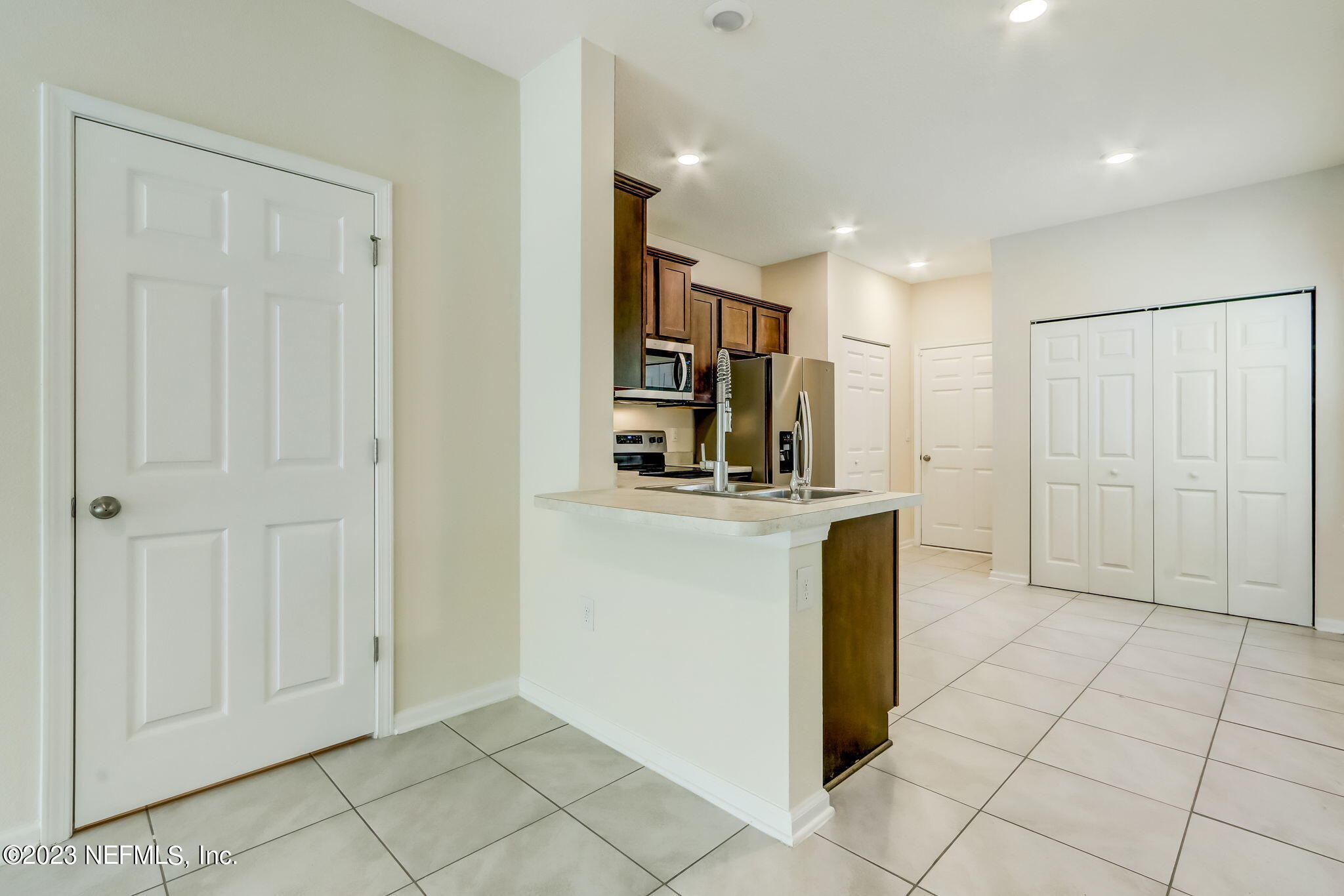 832 Observatory Parkway Jacksonville, FL 32218 - Photo 14 of 27 a view of a kitchen with cabinets