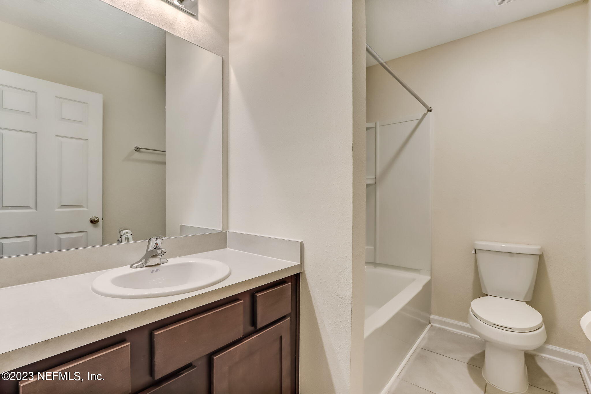 832 Observatory Parkway Jacksonville, FL 32218 - Photo 22 of 27 a bathroom with a sink toilet and a mirror
