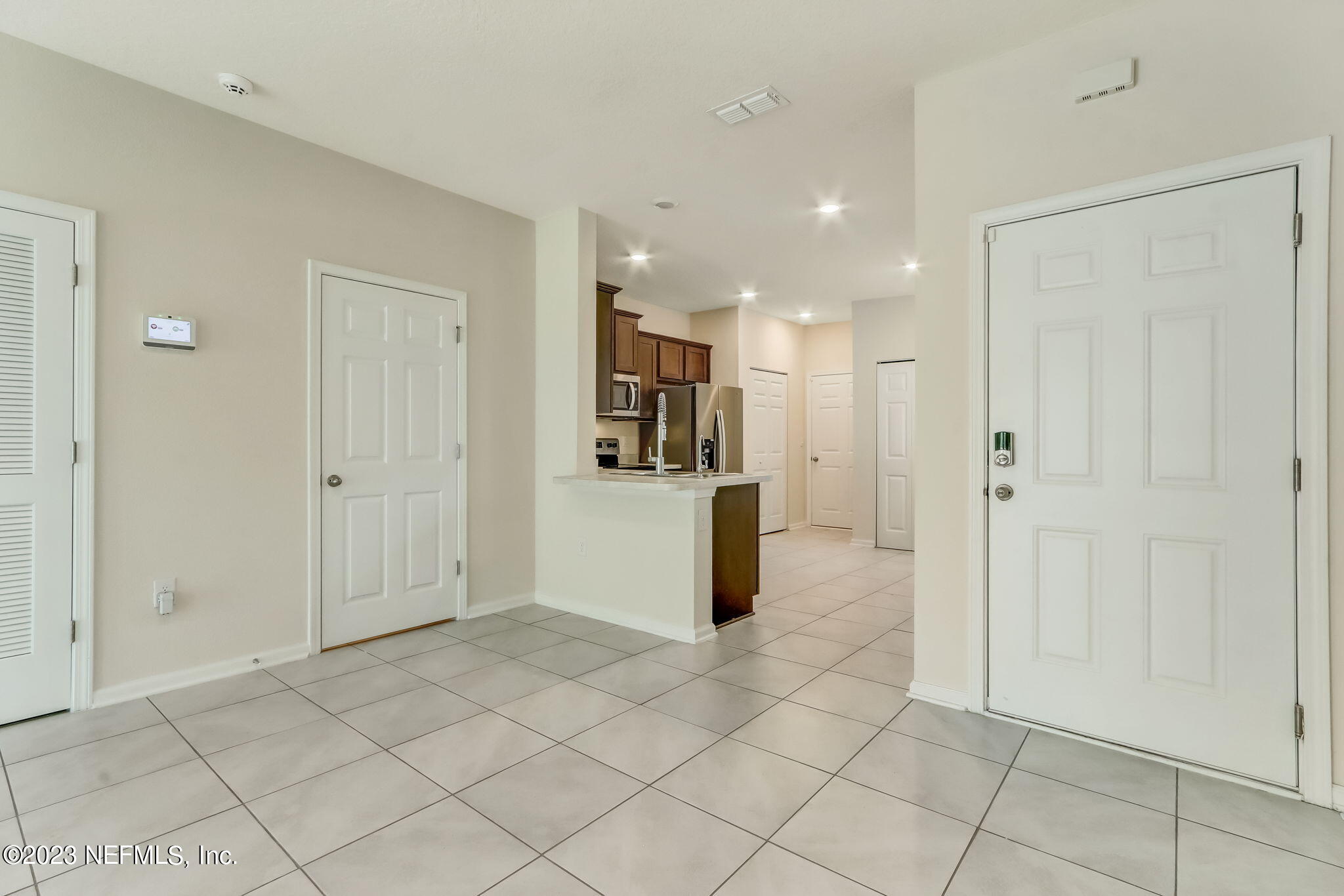 832 Observatory Parkway Jacksonville, FL 32218 - Photo 4 of 27 a view of a kitchen with a refrigerator and a sink