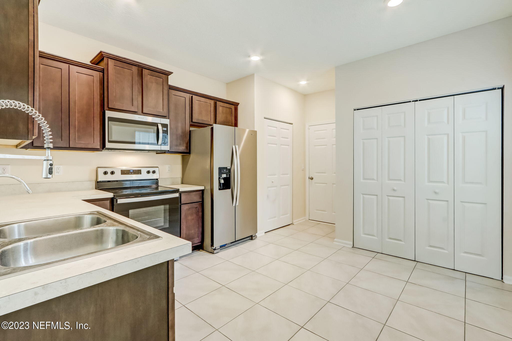 832 Observatory Parkway Jacksonville, FL 32218 - Photo 9 of 27 a kitchen with stainless steel appliances granite countertop a refrigerator and a sink