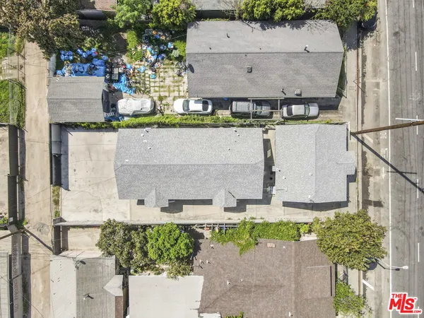 an aerial view of residential building with parking space