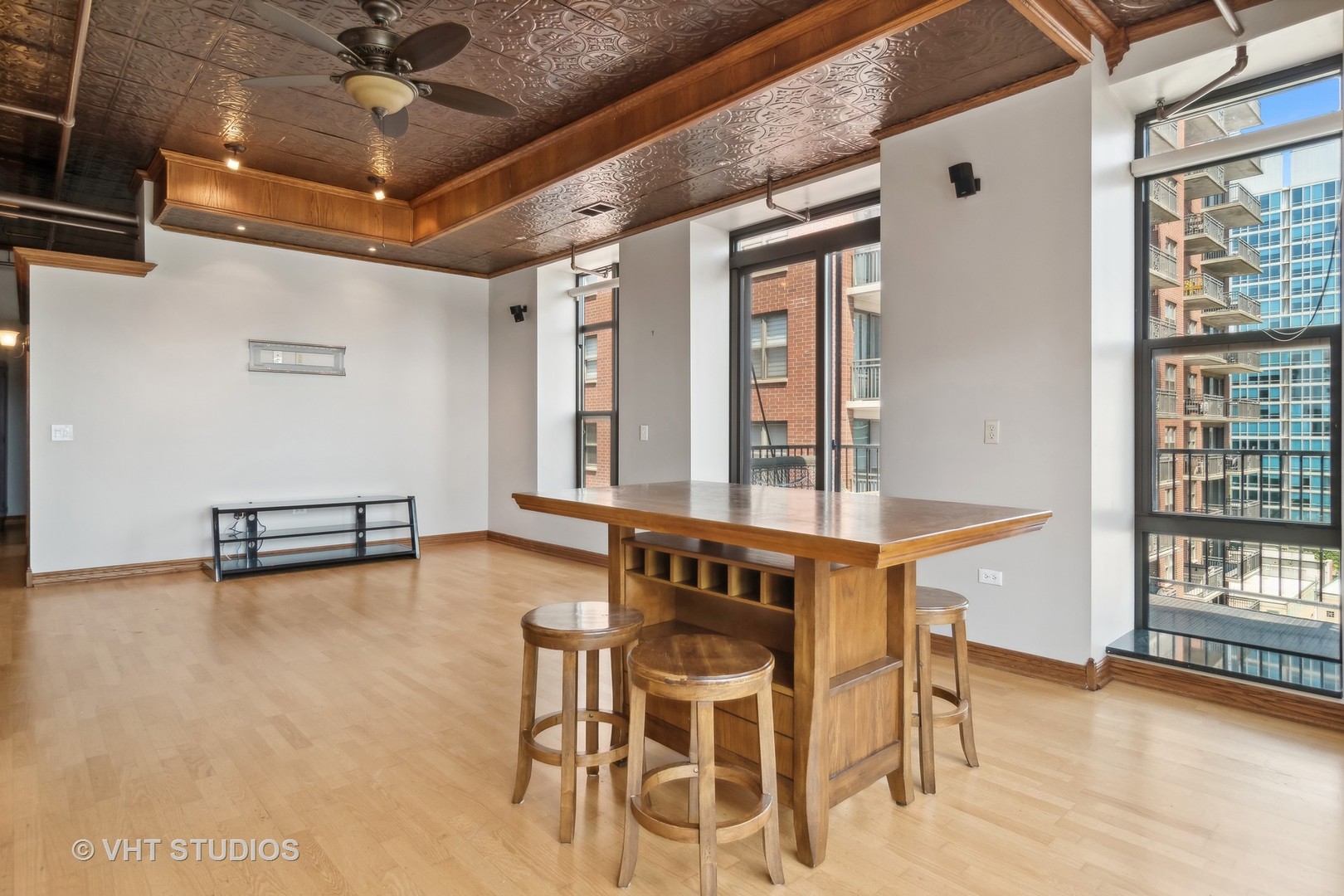 1503 South State Street, Unit 813 Chicago, IL 60605 - Photo 4 of 11 a view of a room with furniture and windows