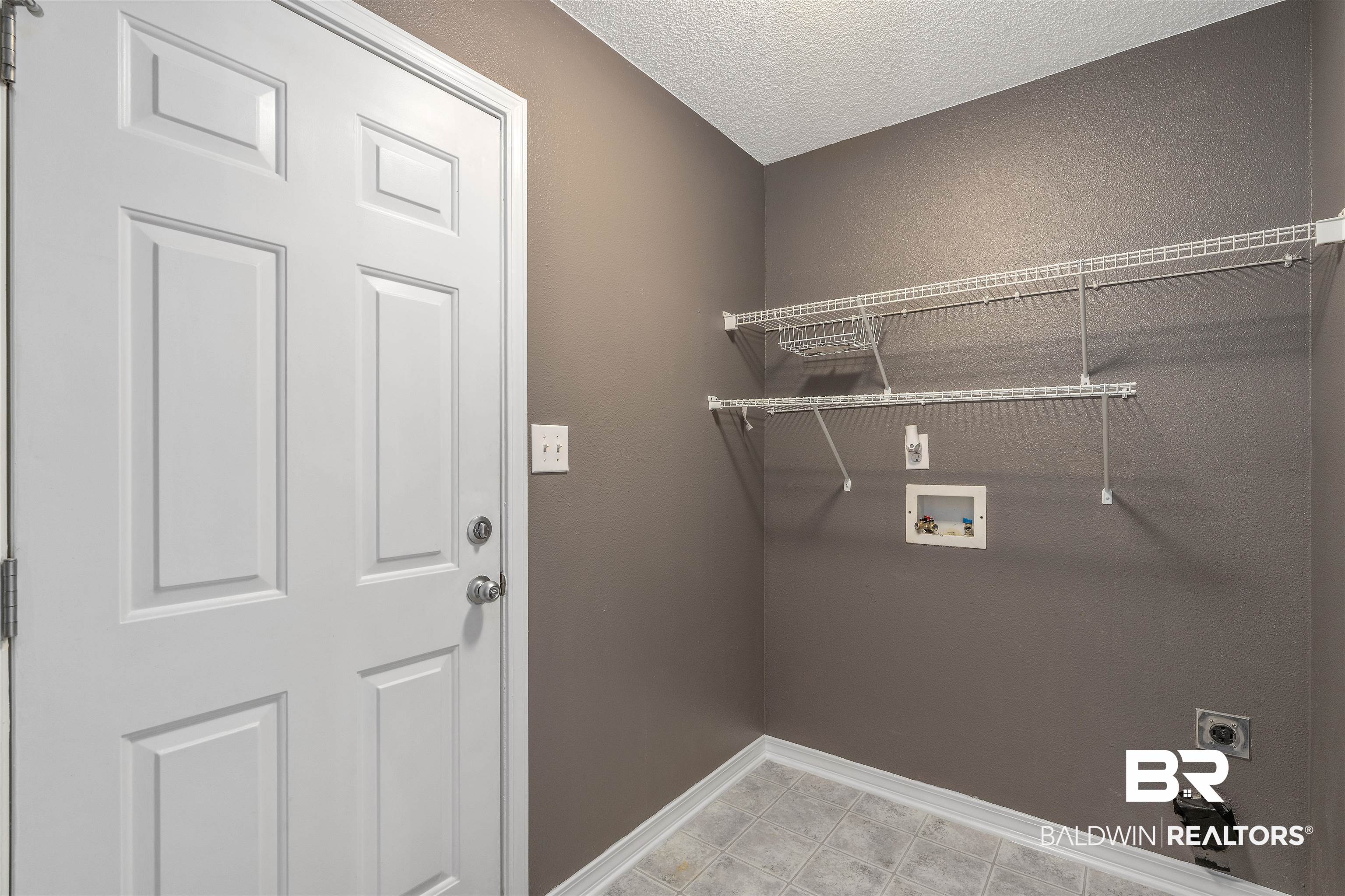 11097 Pontchartrain Loop Daphne, AL 36526 - Photo 25 of 28 Laundry room with hookup for a washing machine, hookup for an electric dryer, and a textured ceiling