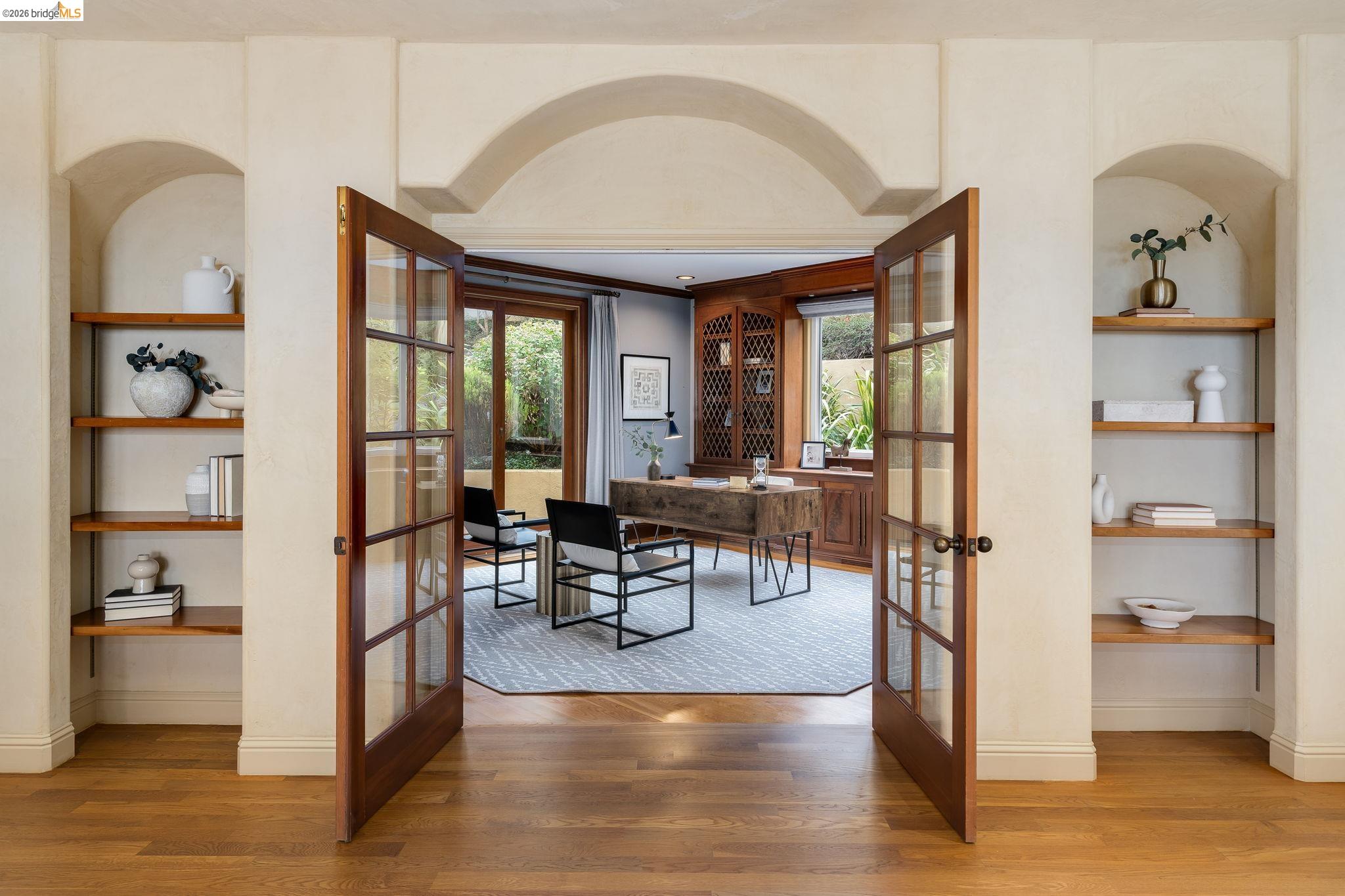 6257 Virgo Road Oakland, CA 94611 - Photo 12 of 60 Dining room with built in shelves, an office area, french doors, and light wood-style flooring