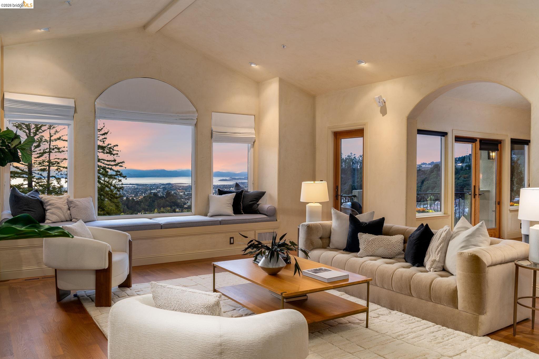 6257 Virgo Road Oakland, CA 94611 - Photo 2 of 60 Living area with wood finished floors and arched walkways
