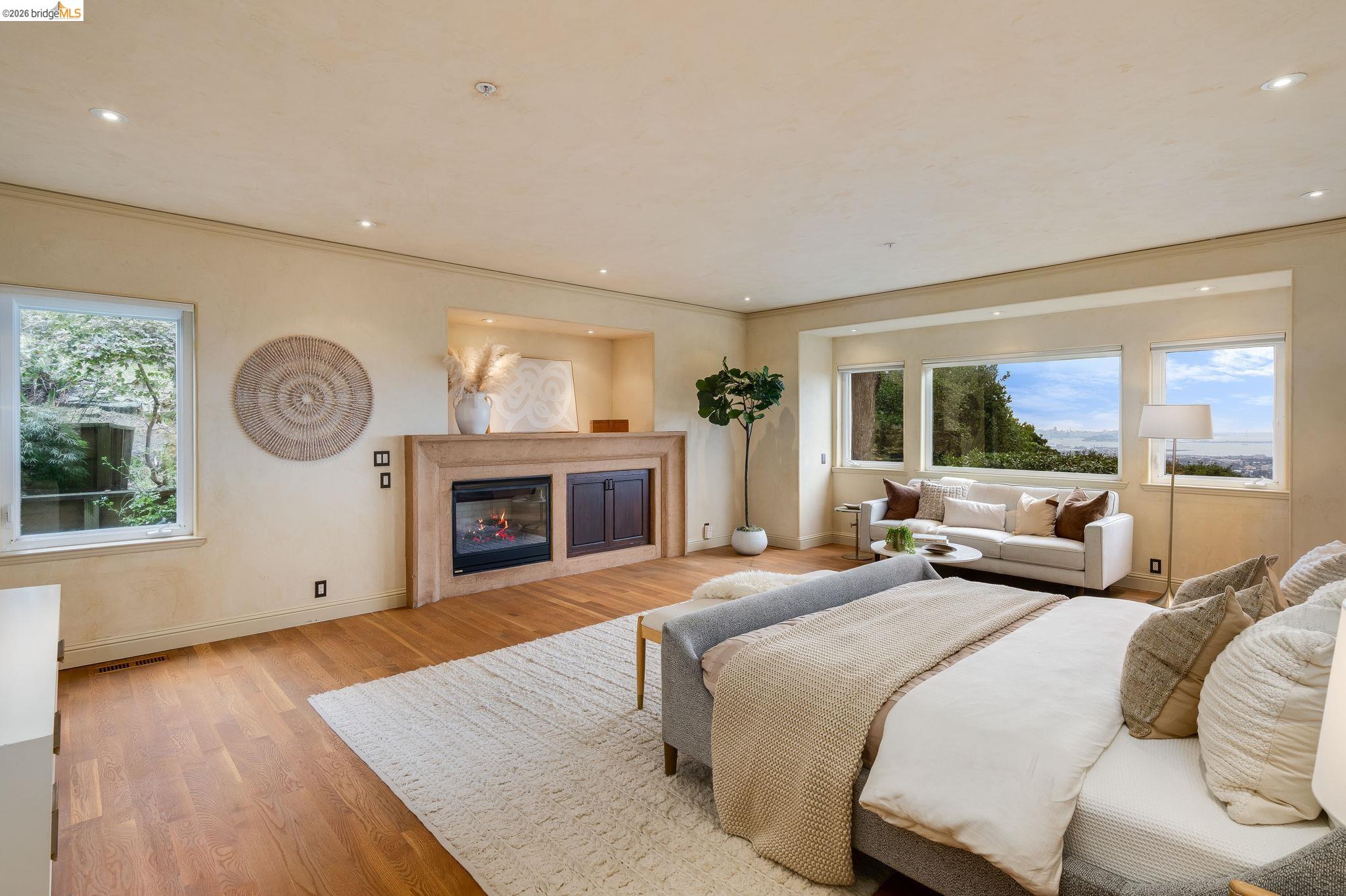 6257 Virgo Road Oakland, CA 94611 - Photo 35 of 60 a bedroom with a bed and a fireplace