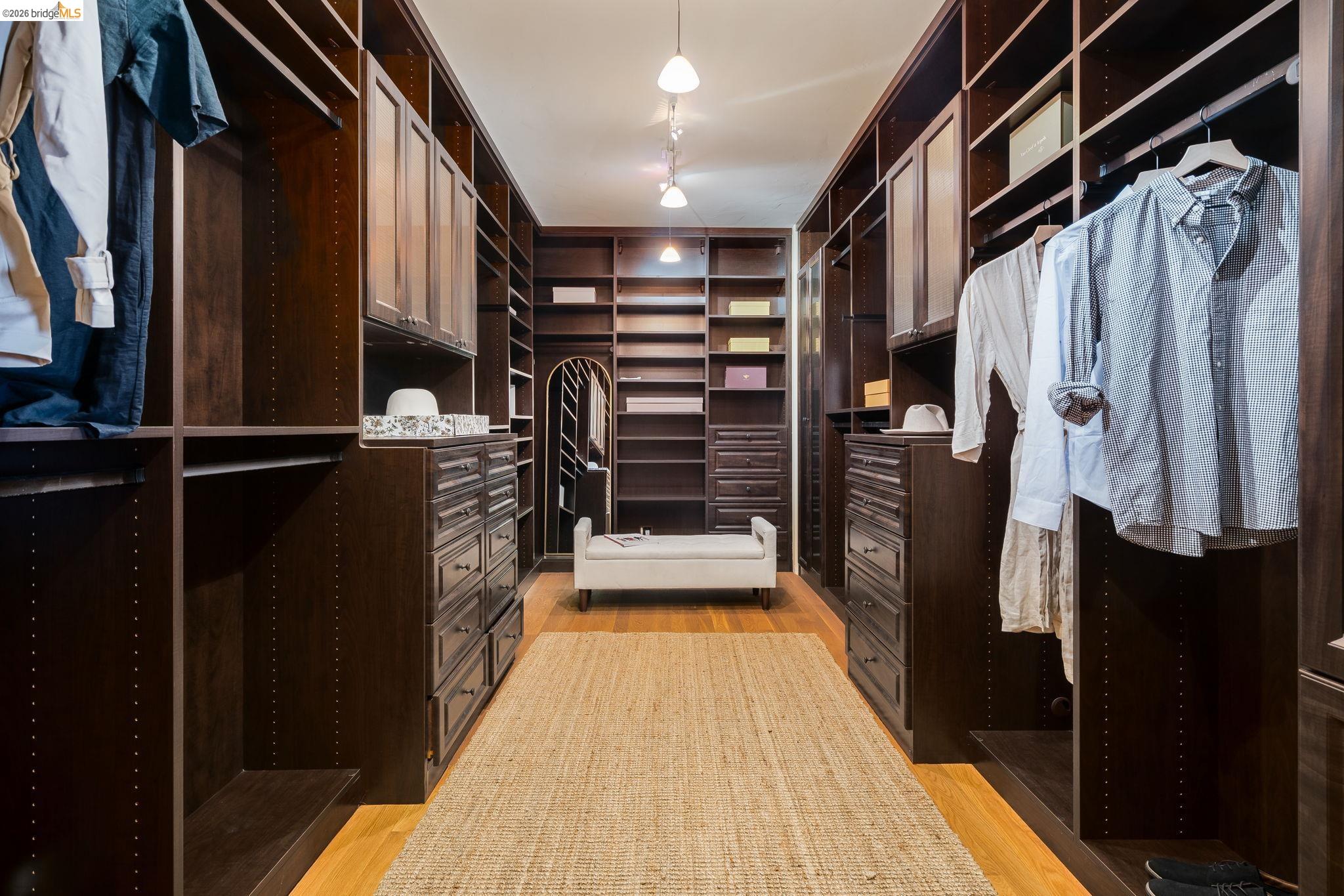 6257 Virgo Road Oakland, CA 94611 - Photo 44 of 60 a walk in closet with wooden floor