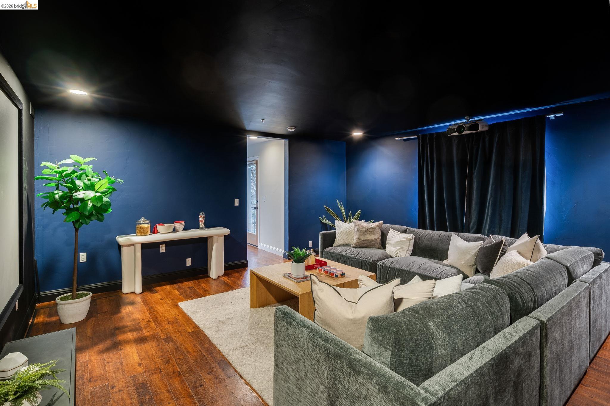 6257 Virgo Road Oakland, CA 94611 - Photo 45 of 60 Home theater with dark wood finished floors