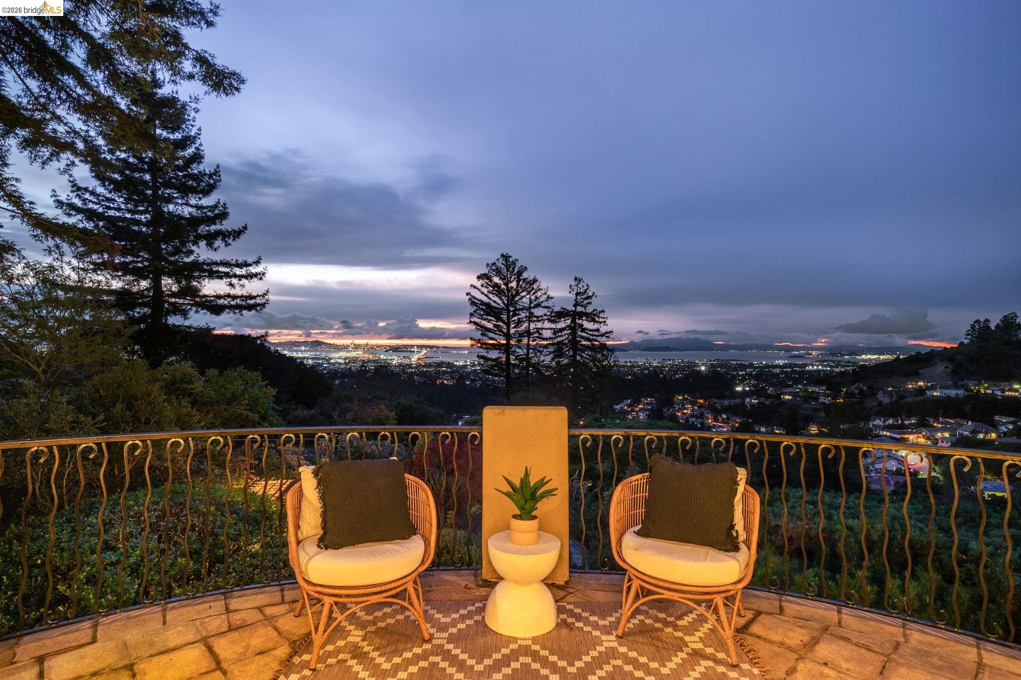 6257 Virgo Road Oakland, CA 94611 - Photo 57 of 60 Patio terrace at dusk with a balcony