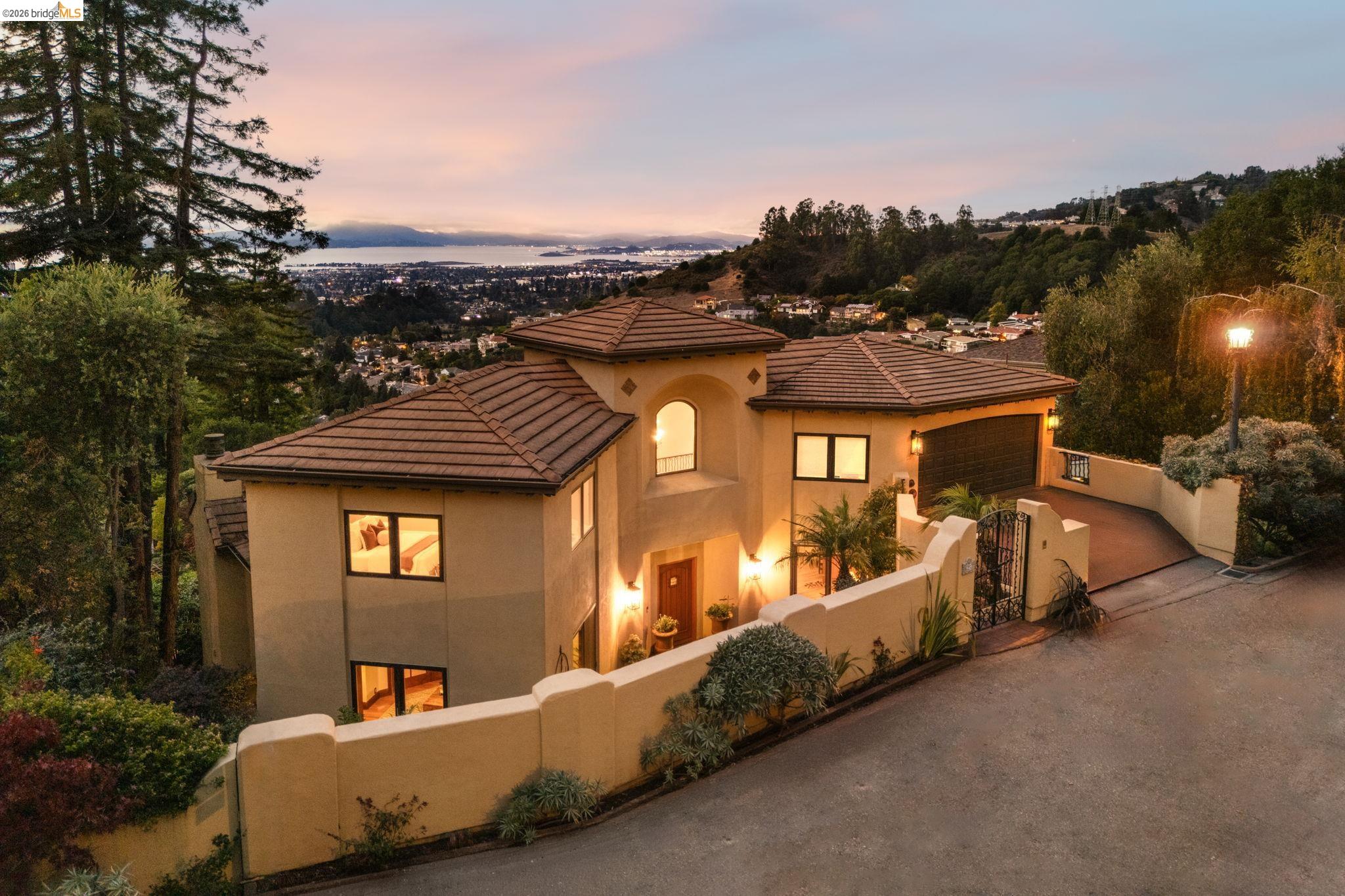 6257 Virgo Road Oakland, CA 94611 - Photo 60 of 60 Mediterranean / spanish-style house featuring a fenced front yard, driveway, stucco siding, and a gate