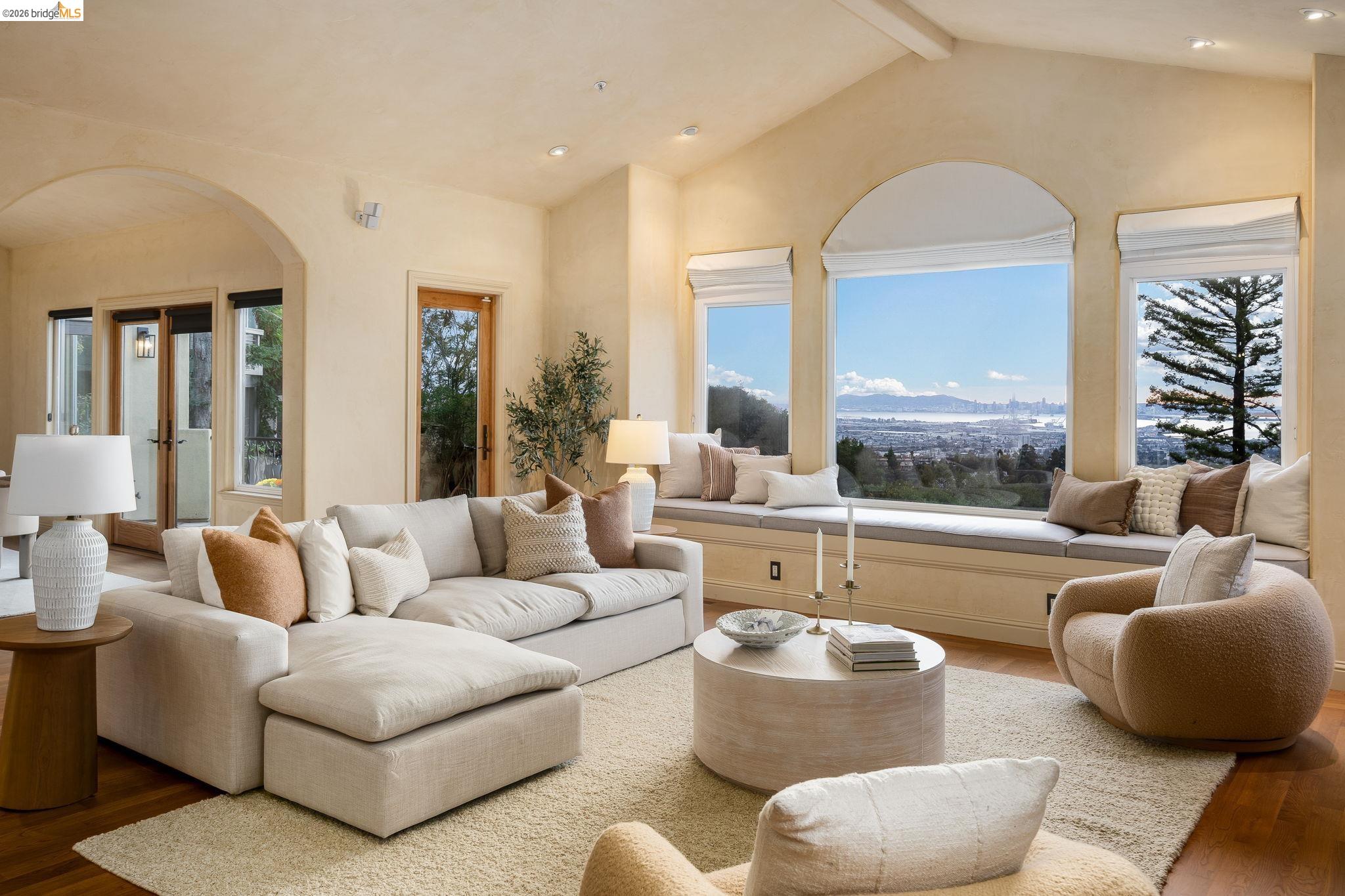 6257 Virgo Road Oakland, CA 94611 - Photo 8 of 60 Living area with wood finished floors, arched walkways, recessed lighting, and a mountain view