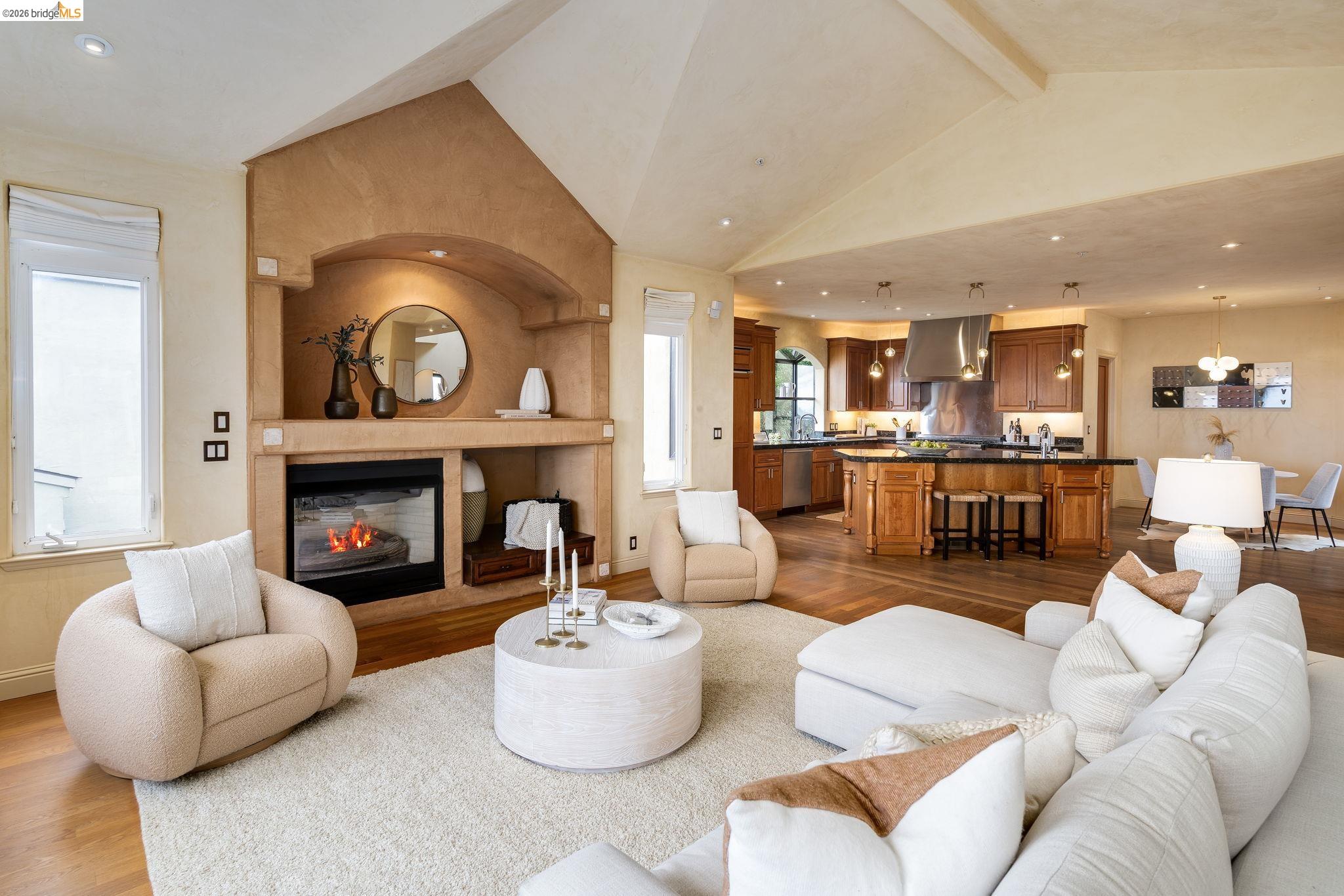 6257 Virgo Road Oakland, CA 94611 - Photo 9 of 60 Living room with light wood finished floors, a glass covered fireplace, and recessed lighting