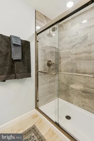 a bathroom with a sink toilet and a mirror