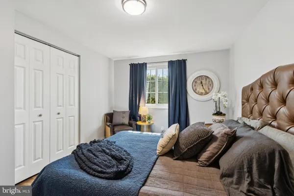 a bedroom with a bed and a table in it