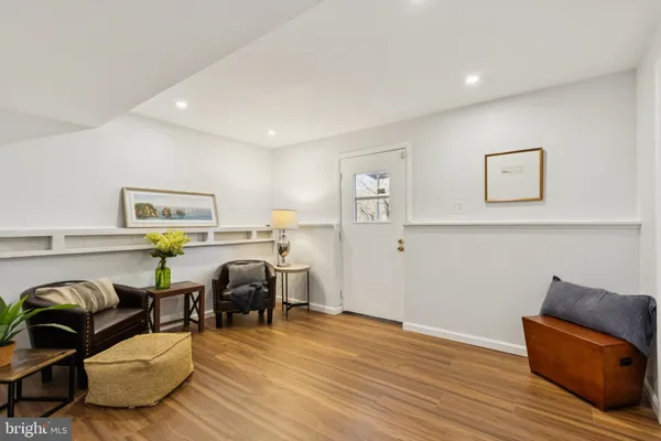 a view of a livingroom with furniture and wooden floor