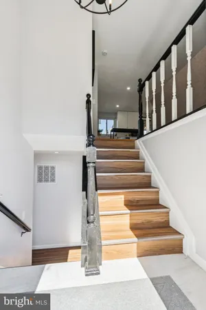 a view of staircase with white walls