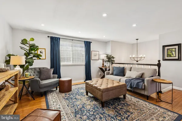a living room with furniture and a table