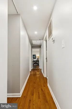 a kitchen with granite countertop a sink stove and refrigerator
