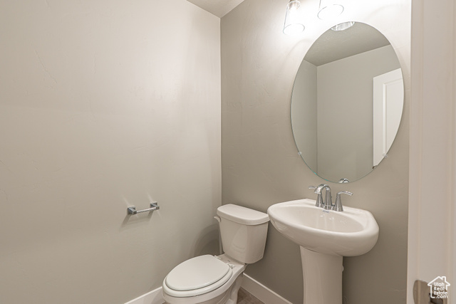 2242 South 1120 West, Unit 69 Logan, UT 84321 - Photo 13 of 26 Bathroom featuring toilet and baseboards