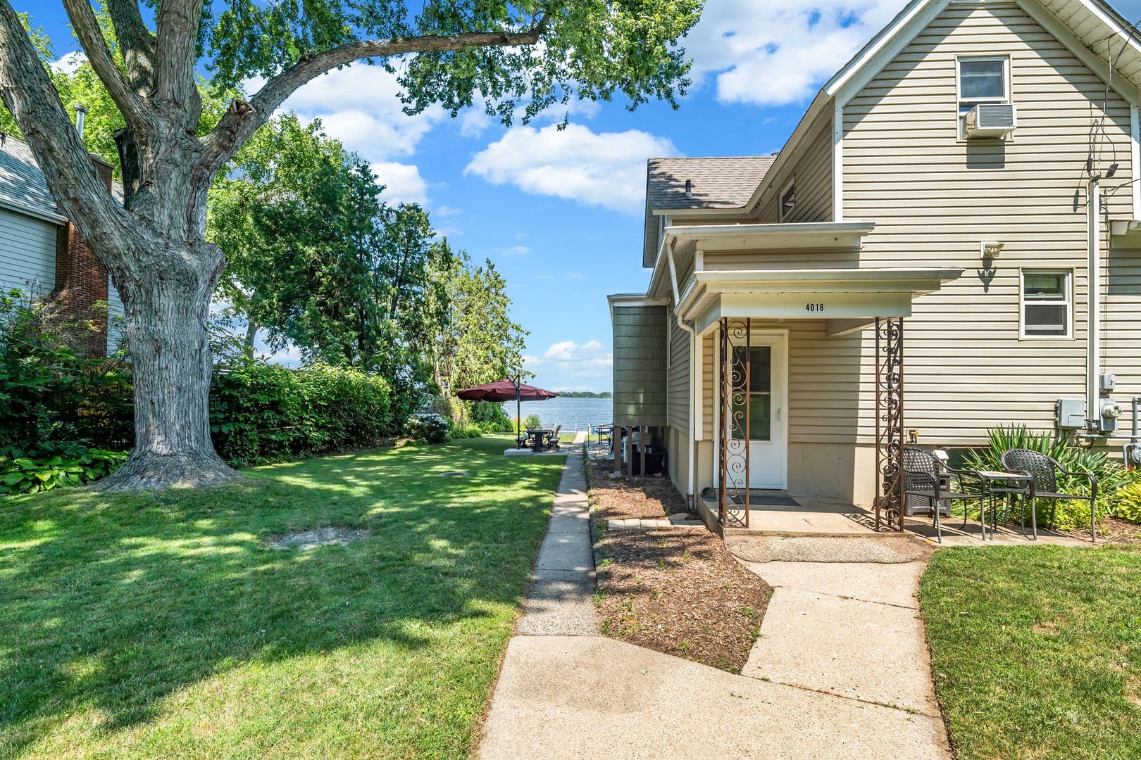 4018 Pitzen Road Johnsburg, IL 60051 - Photo 11 of 47 a house with garden in front of it