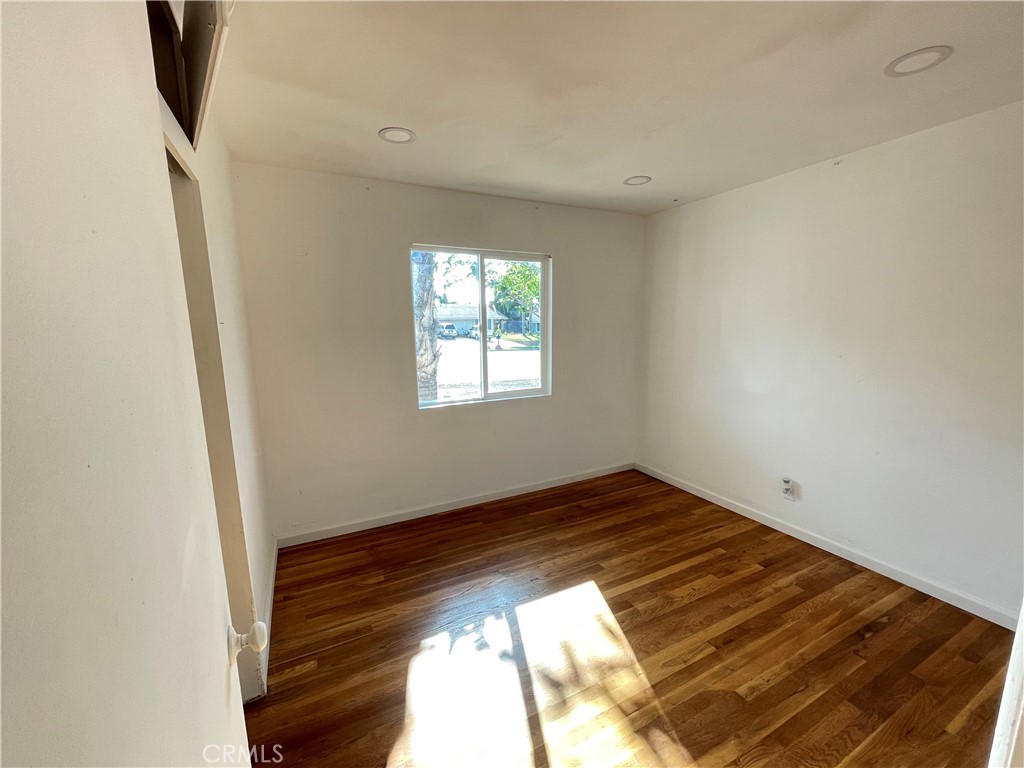 3005 Mary Street Riverside, CA 92506 - Photo 5 of 9 a view of empty room with wooden floor and fan