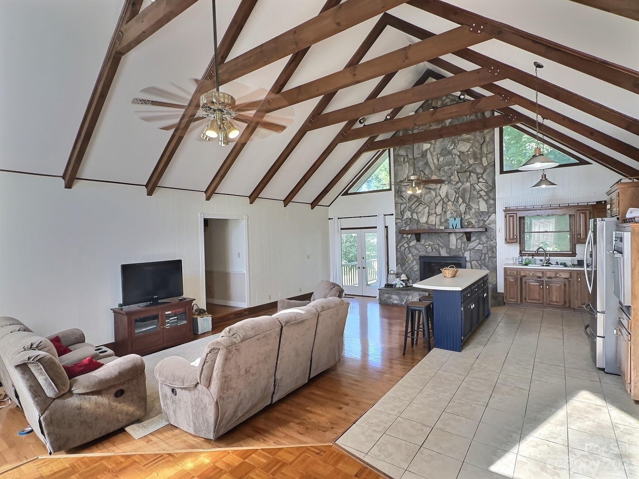 221 Airport Road Rutherfordton, NC 28139 - Photo 3 of 16 a living room with furniture a fireplace and a table