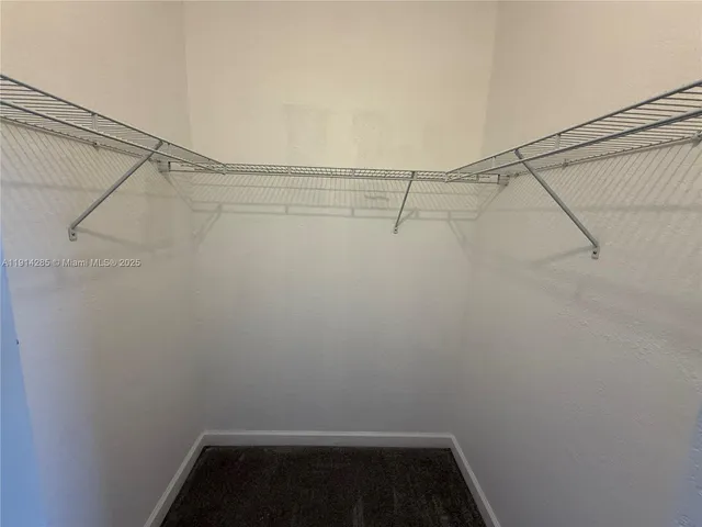 a view of a room with racks on the wall