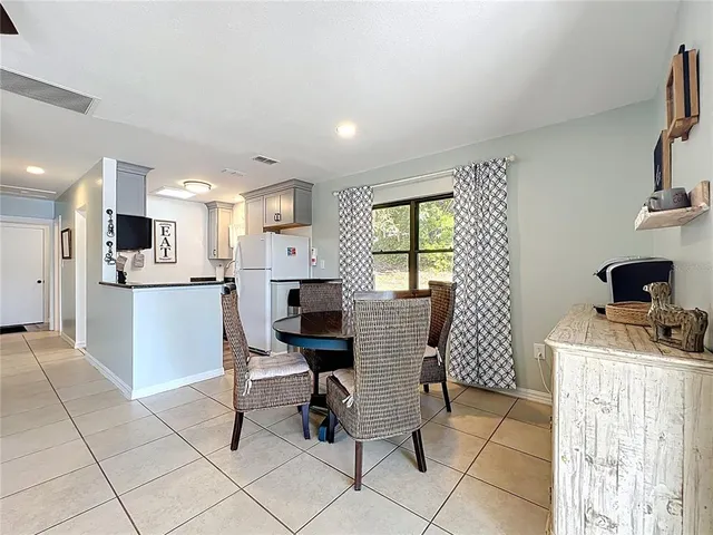 a kitchen with stainless steel appliances granite countertop a stove and a microwave