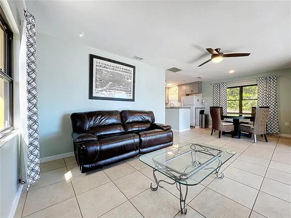 a kitchen with granite countertop a sink and a stove top oven