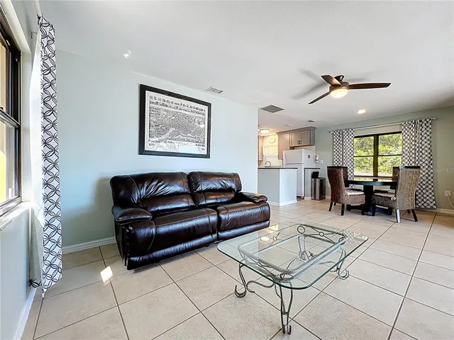 a kitchen with granite countertop a sink and a stove top oven