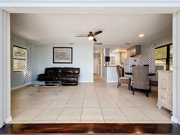 a view of an empty room with a fireplace and a large window