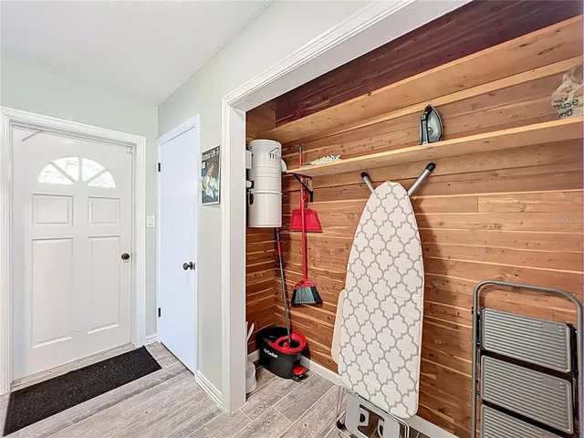 a view of flowing water with large trees