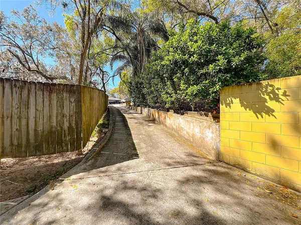 a backyard of a house with table and chairs