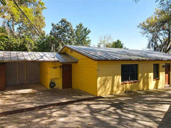 an aerial view of a city with lots of residential buildings and lake view