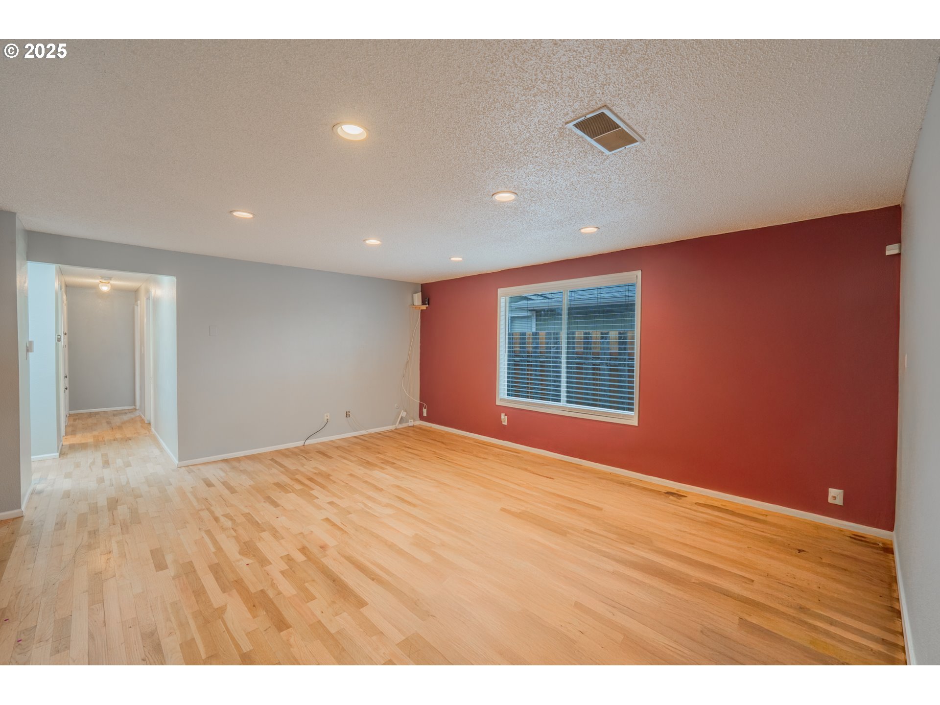 446 44th Avenue Southeast Salem, OR 97317 - Photo 15 of 37 a view of an empty room with wooden floor and a window