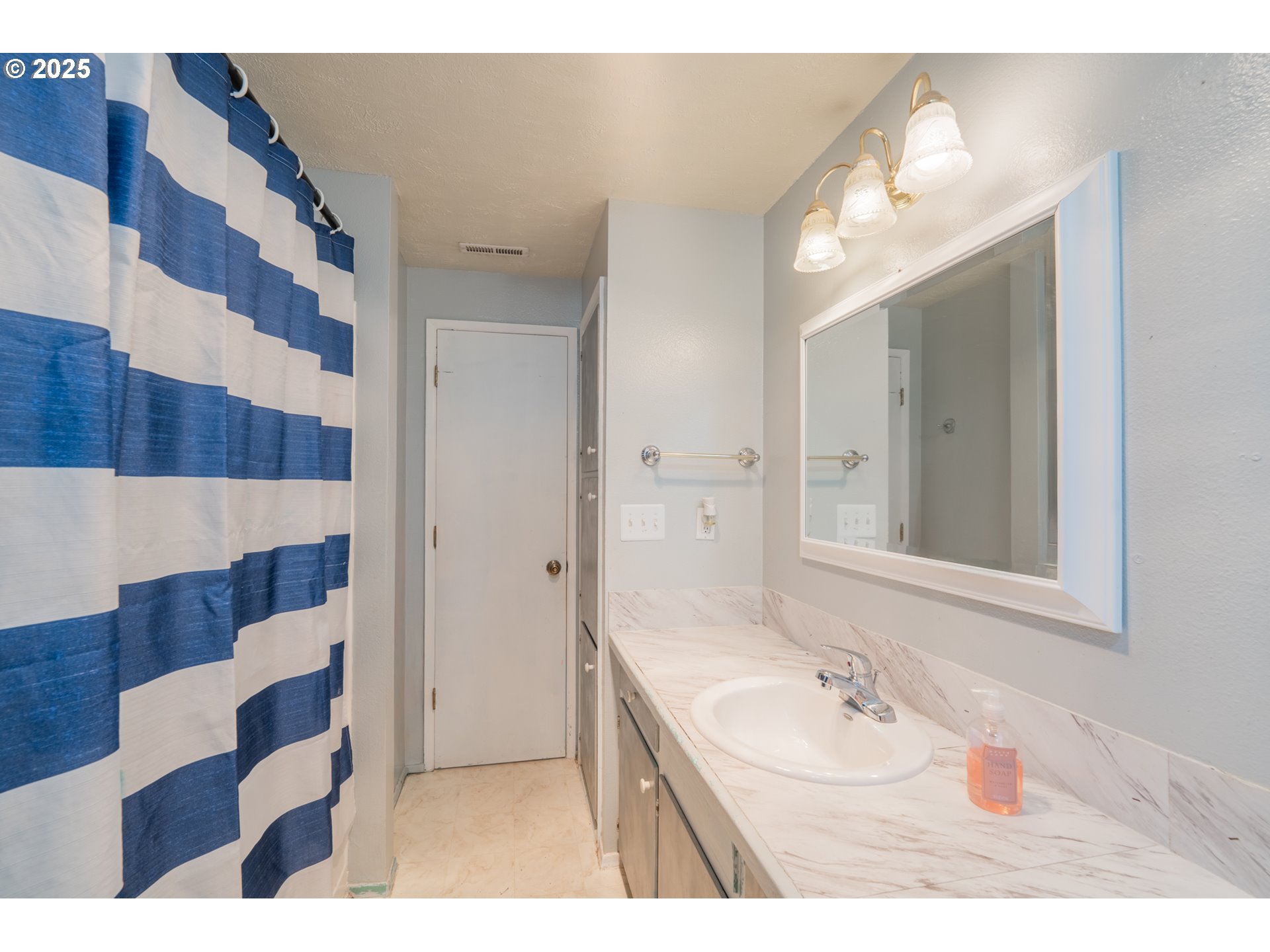 446 44th Avenue Southeast Salem, OR 97317 - Photo 28 of 37 a bathroom with a sink a toilet a mirror and shower