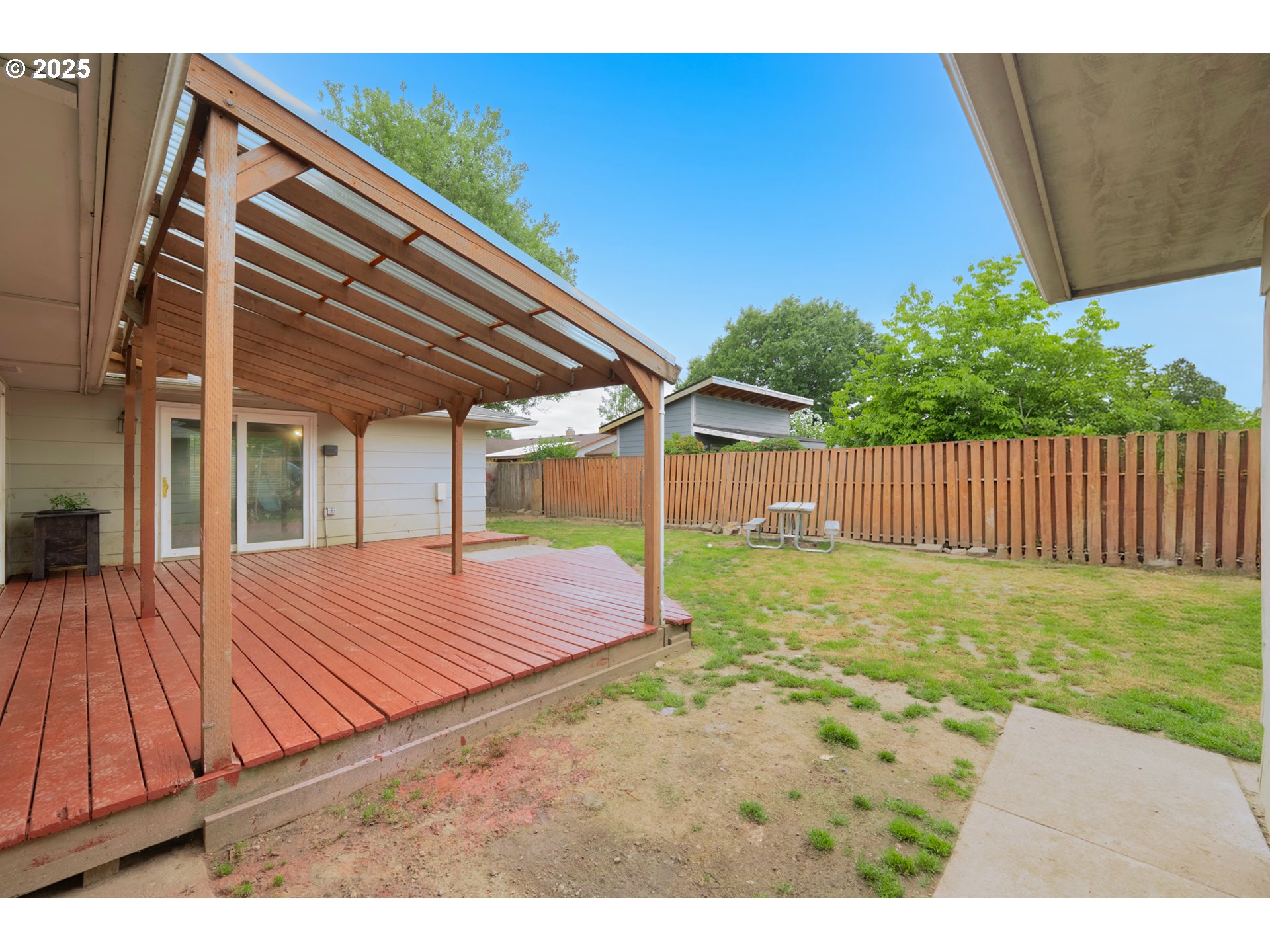 446 44th Avenue Southeast Salem, OR 97317 - Photo 5 of 37 a backyard of a house with table and chairs