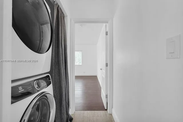 a view of an entryway with wooden floor