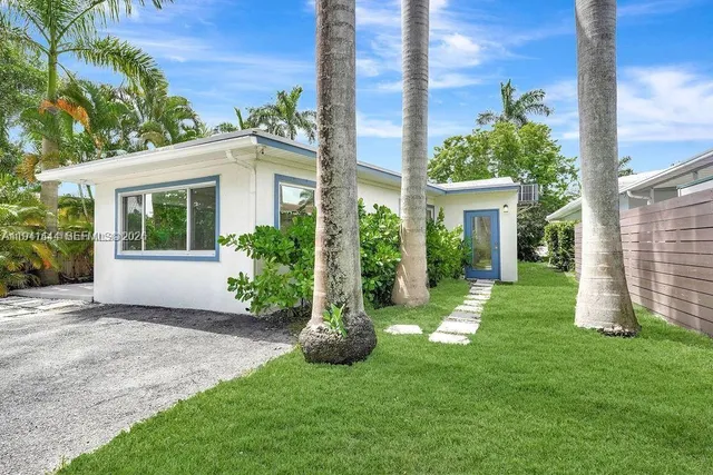 a view of a balcony with potted plants
