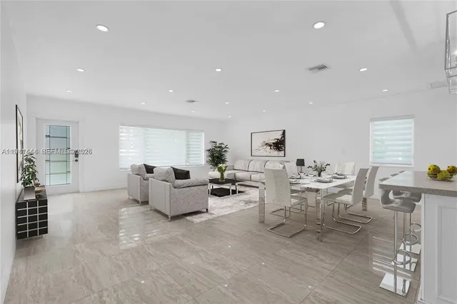 a view of a kitchen with a sink and dishwasher a refrigerator with wooden floor