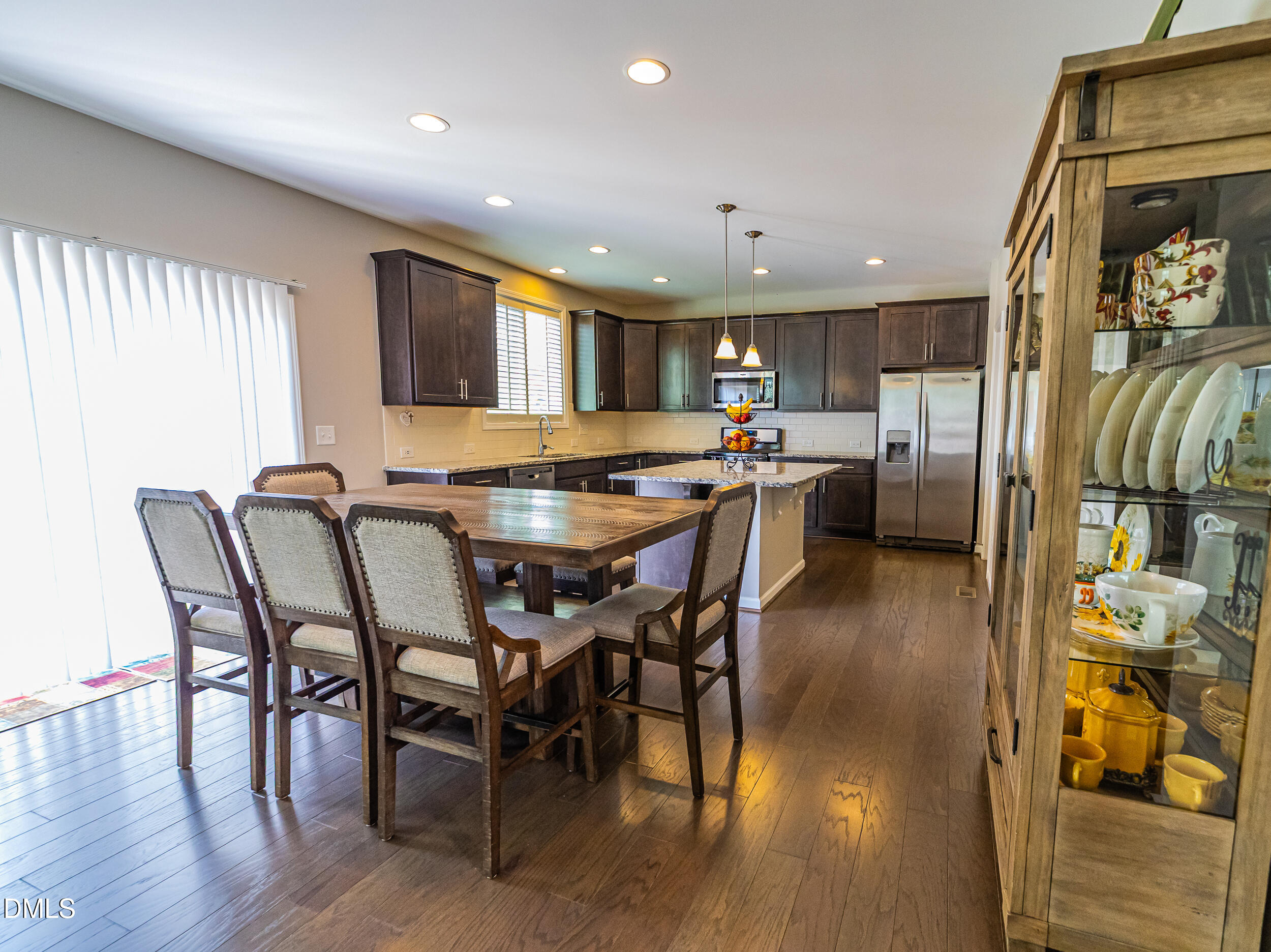 4416 Brintons Cottage Street Raleigh, NC 27616 - Photo 19 of 40 a view of a dining room with furniture and wooden floor