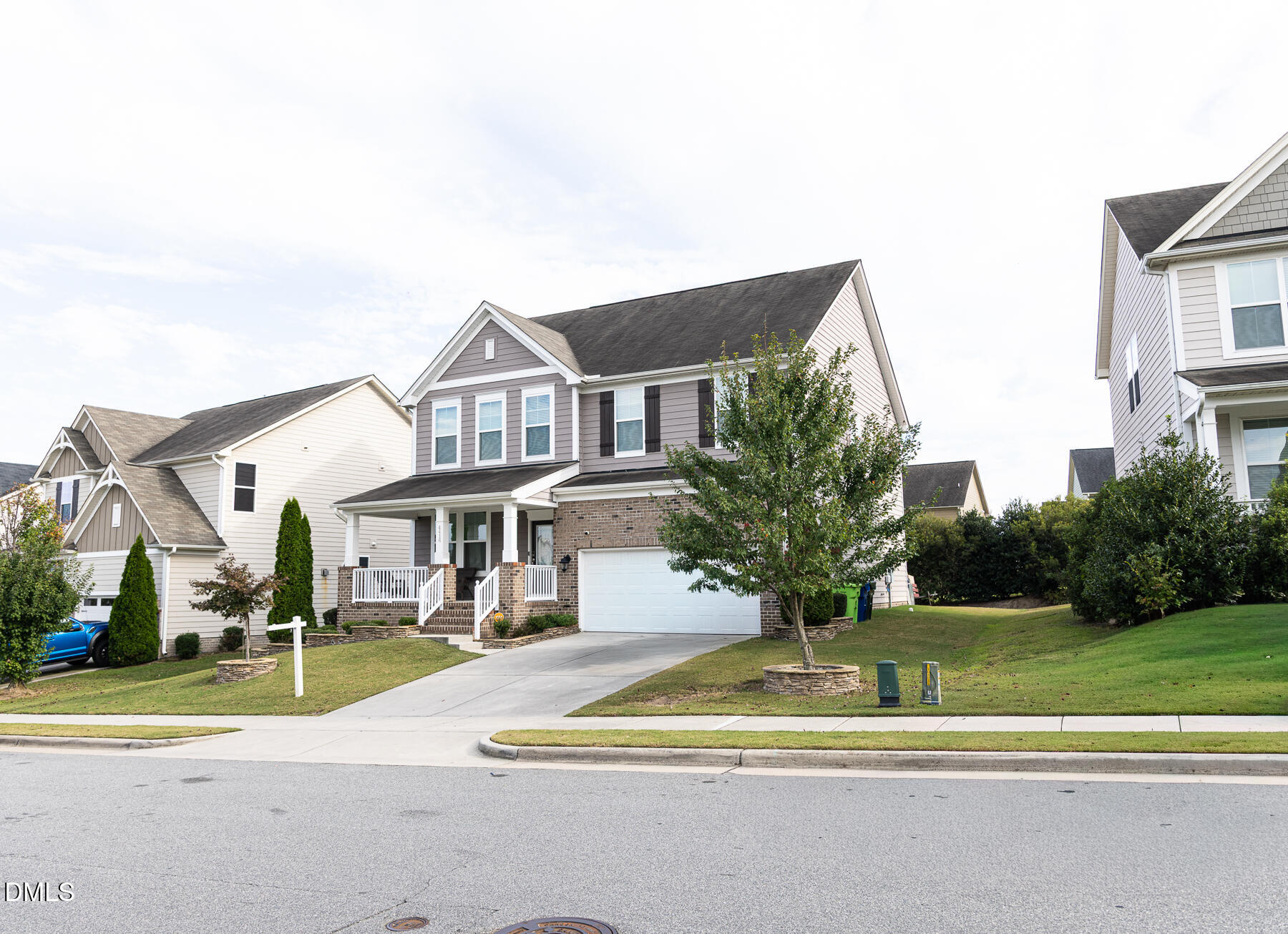 4416 Brintons Cottage Street Raleigh, NC 27616 - Photo 2 of 40 a front view of a house with a yard table and chairs