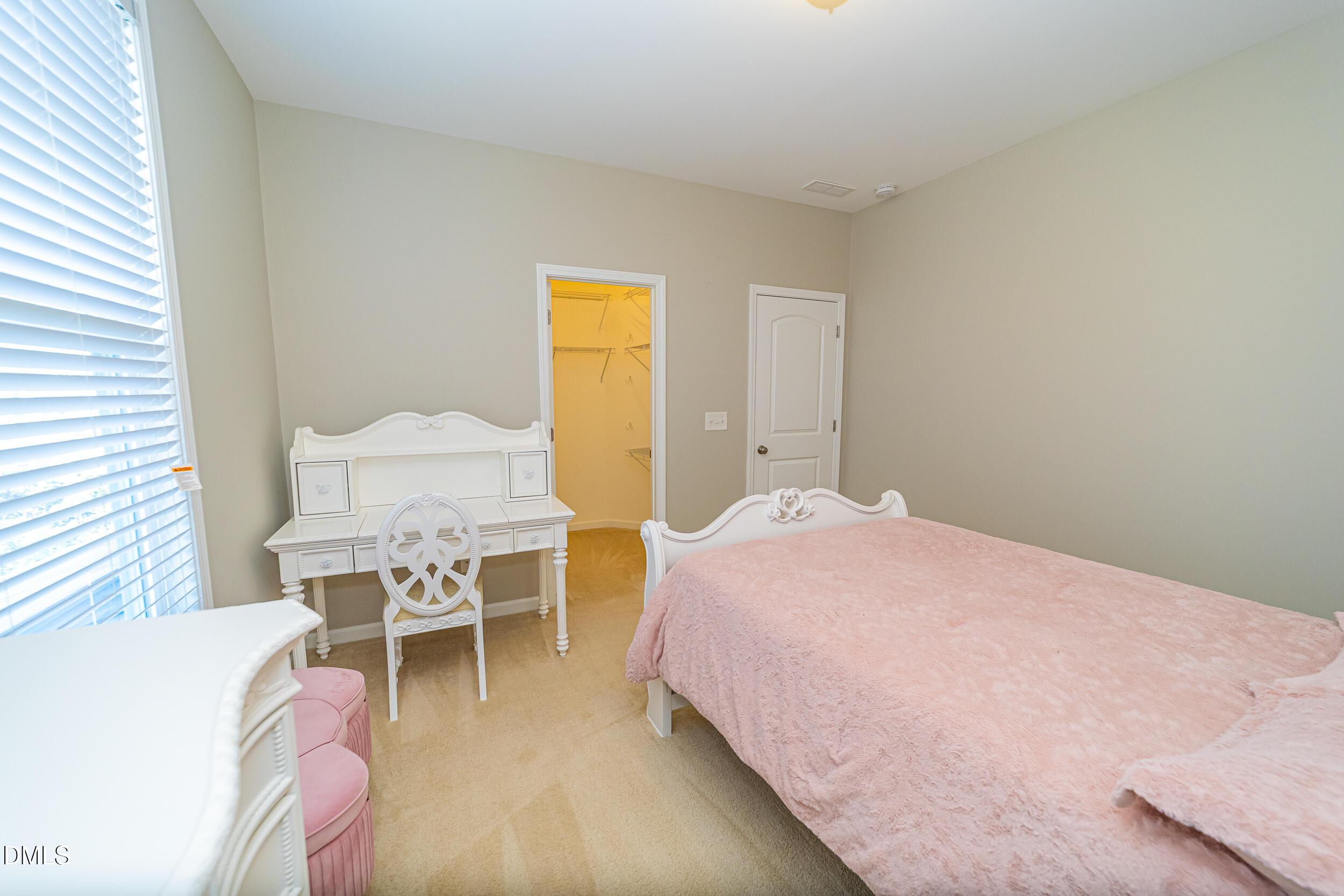 4416 Brintons Cottage Street Raleigh, NC 27616 - Photo 31 of 40 a bedroom with a bed and chair