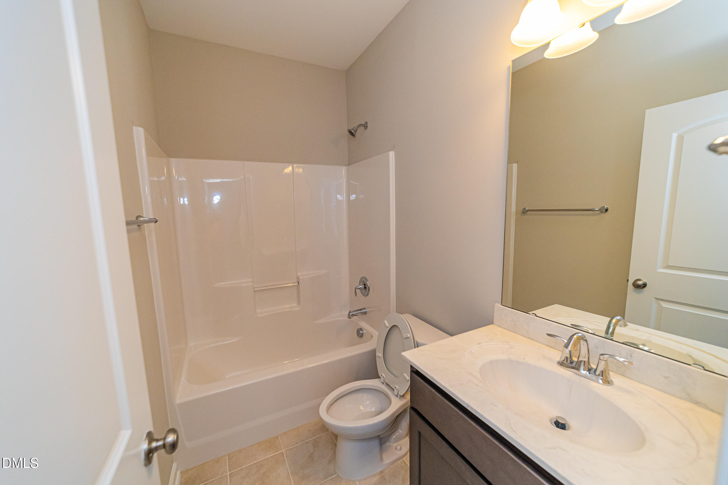 4416 Brintons Cottage Street Raleigh, NC 27616 - Photo 34 of 40 a bathroom with a sink a toilet and shower