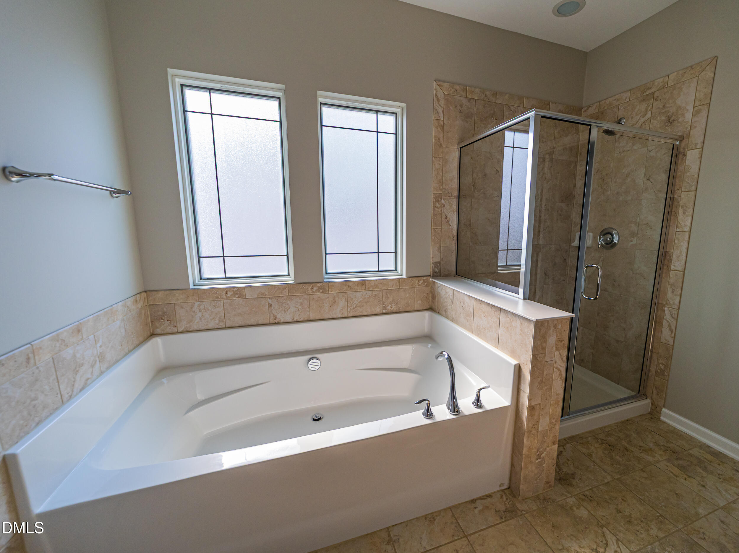 4416 Brintons Cottage Street Raleigh, NC 27616 - Photo 35 of 40 a bathroom with a bathtub and a shower