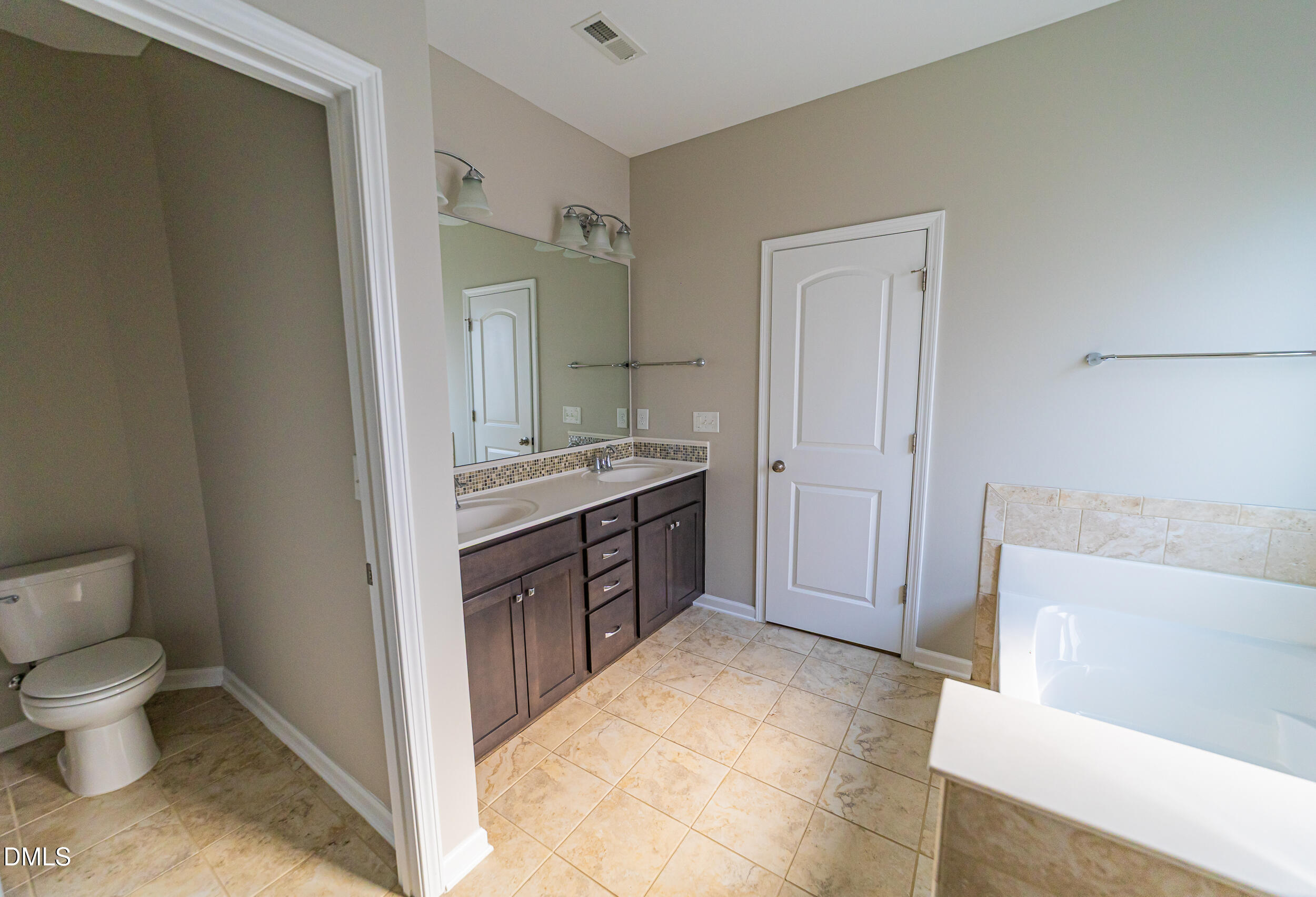 4416 Brintons Cottage Street Raleigh, NC 27616 - Photo 36 of 40 a spacious bathroom with a bathtub sink mirror and toilet
