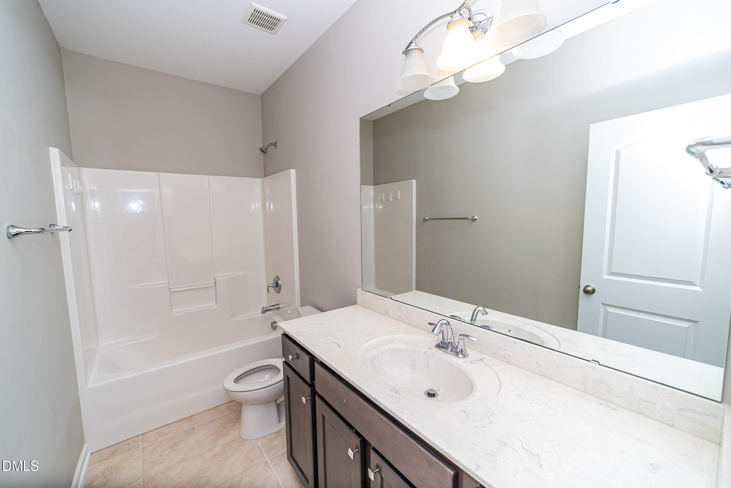 4416 Brintons Cottage Street Raleigh, NC 27616 - Photo 39 of 40 a bathroom with a sink a toilet and shower