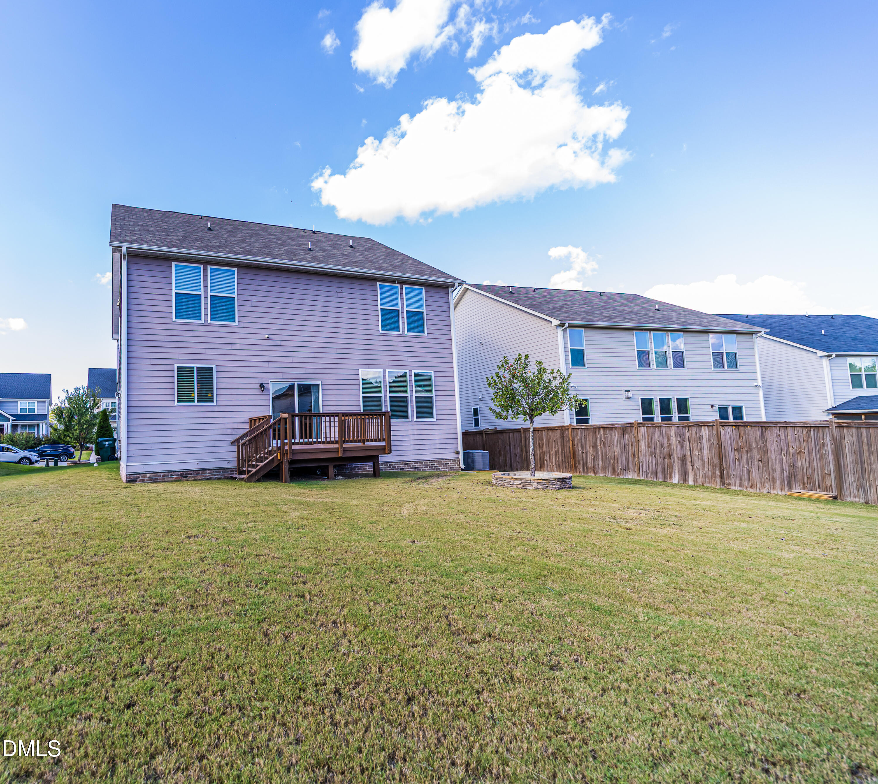 4416 Brintons Cottage Street Raleigh, NC 27616 - Photo 5 of 40 a view of a house with a yard and a large tree