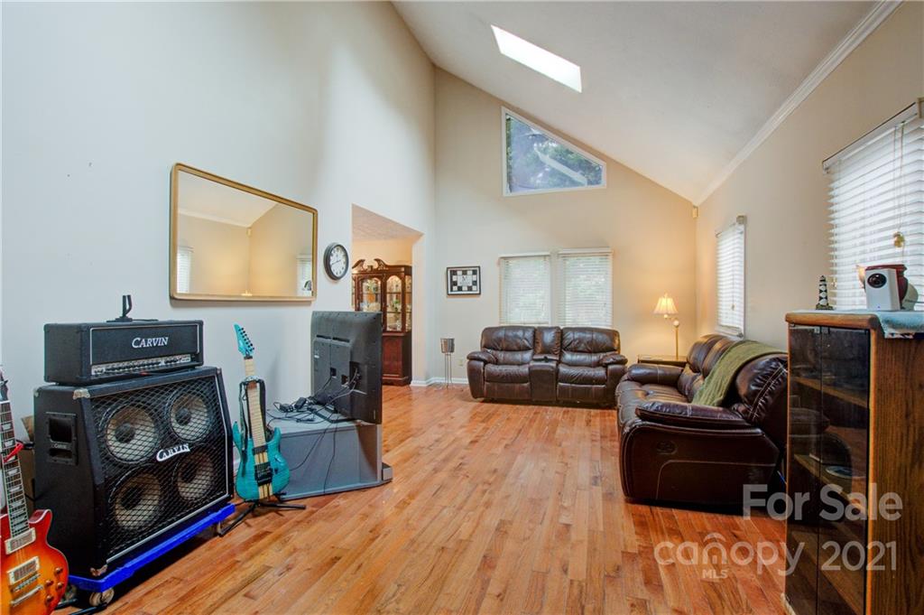 262 Spring Run Road Mooresville, NC 28117 - Photo 11 of 42 a living room with furniture and a wooden floor
