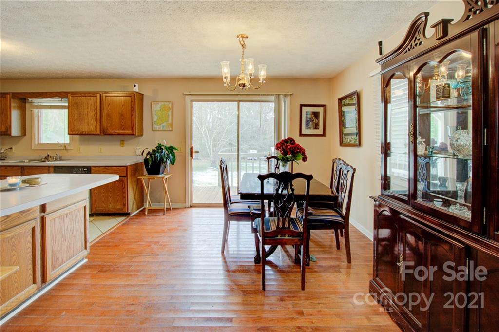 262 Spring Run Road Mooresville, NC 28117 - Photo 14 of 42 a view of a dining room with furniture window and wooden floor